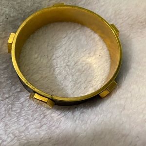 Gold.  With black.  Medal.   Tri